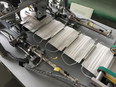 Machine de soudure ultrasons pour boucle externe de masque jetable